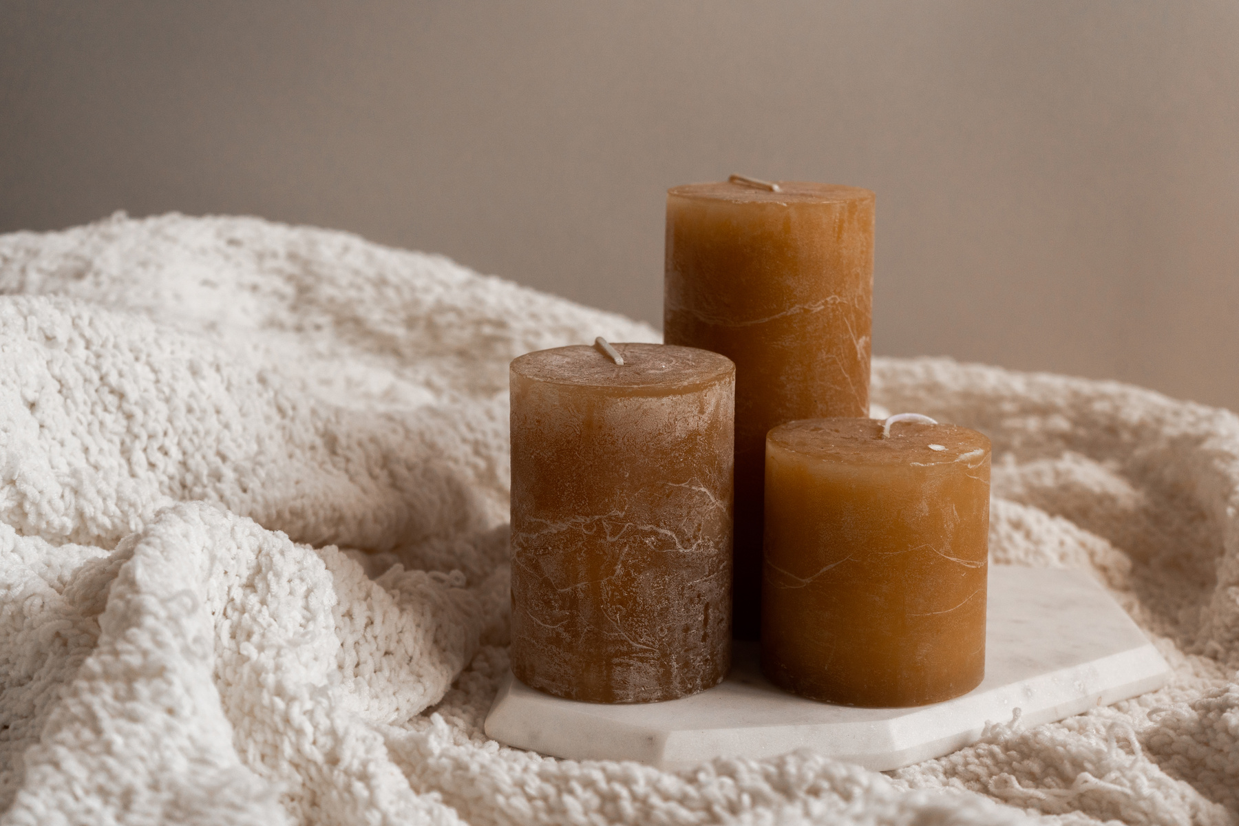 Brown Candles on Wool Blanket